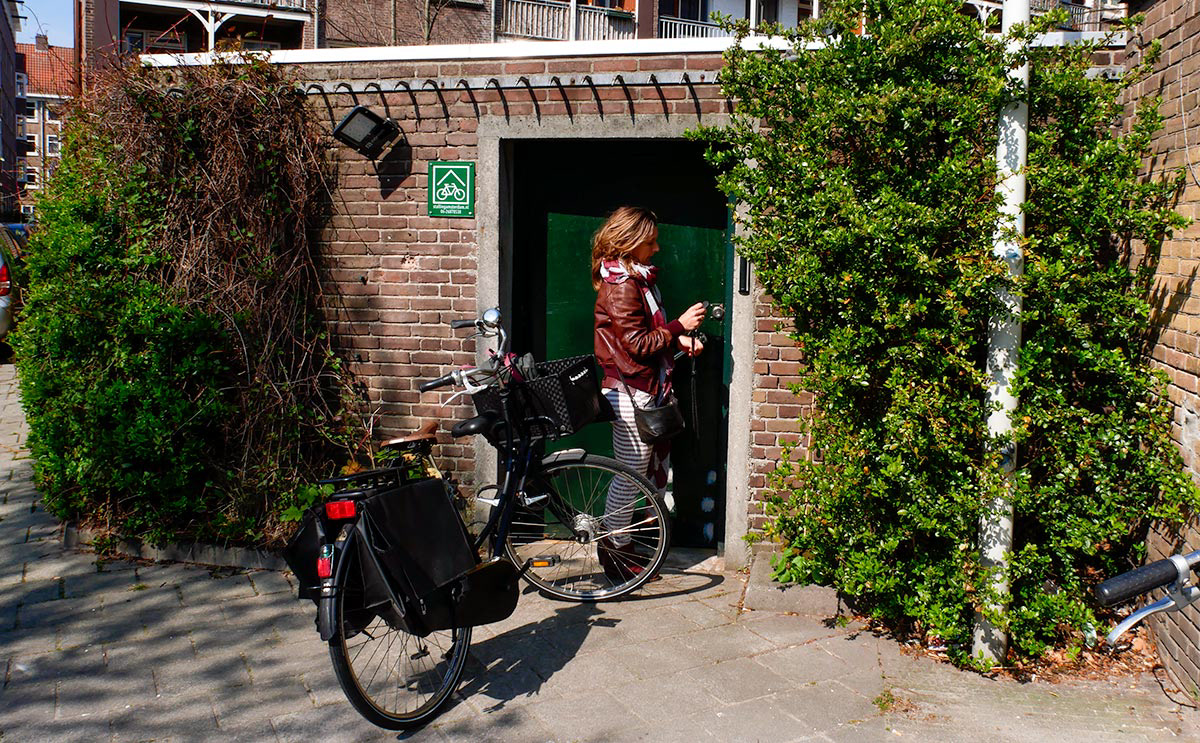Cyclist entering a neighbourhood bike storage
